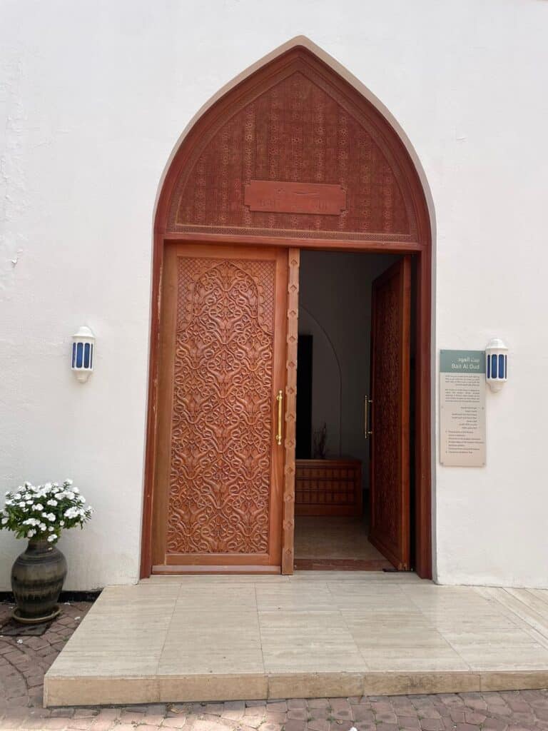 The wooden door entrance to Bait Al Bargh inside Bait Al Zubair museum.