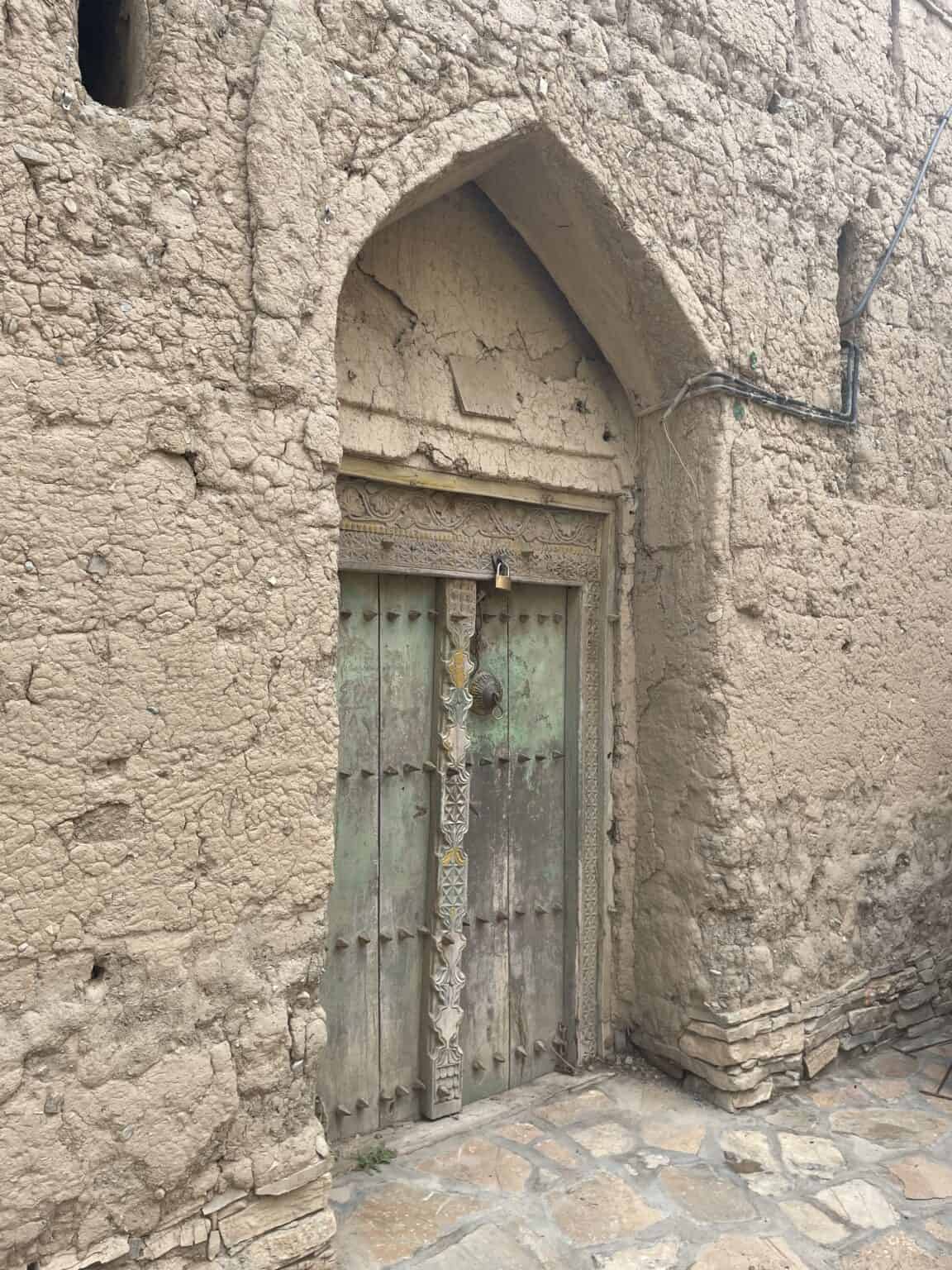 A traditional wooden door in the Sibani neighbourhood of Birkat al Mouz, Oman
