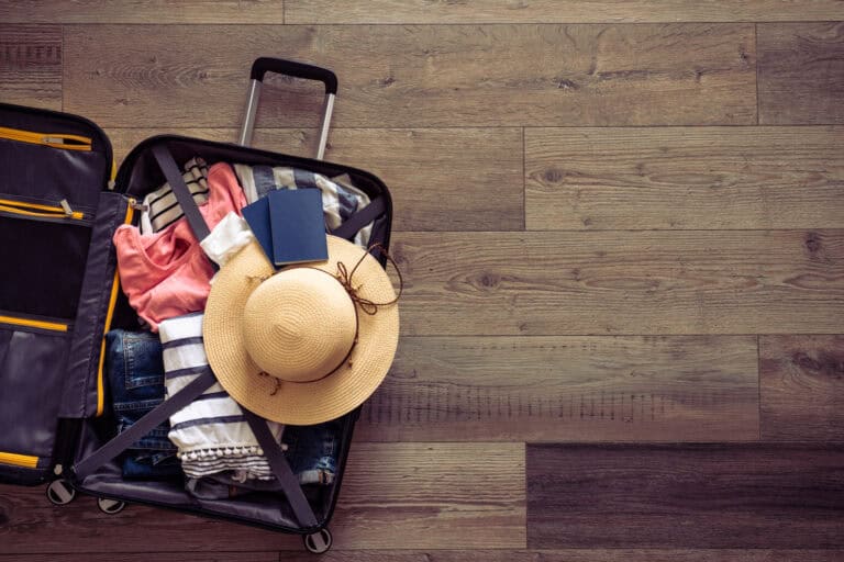 Suitcase with a sun hat