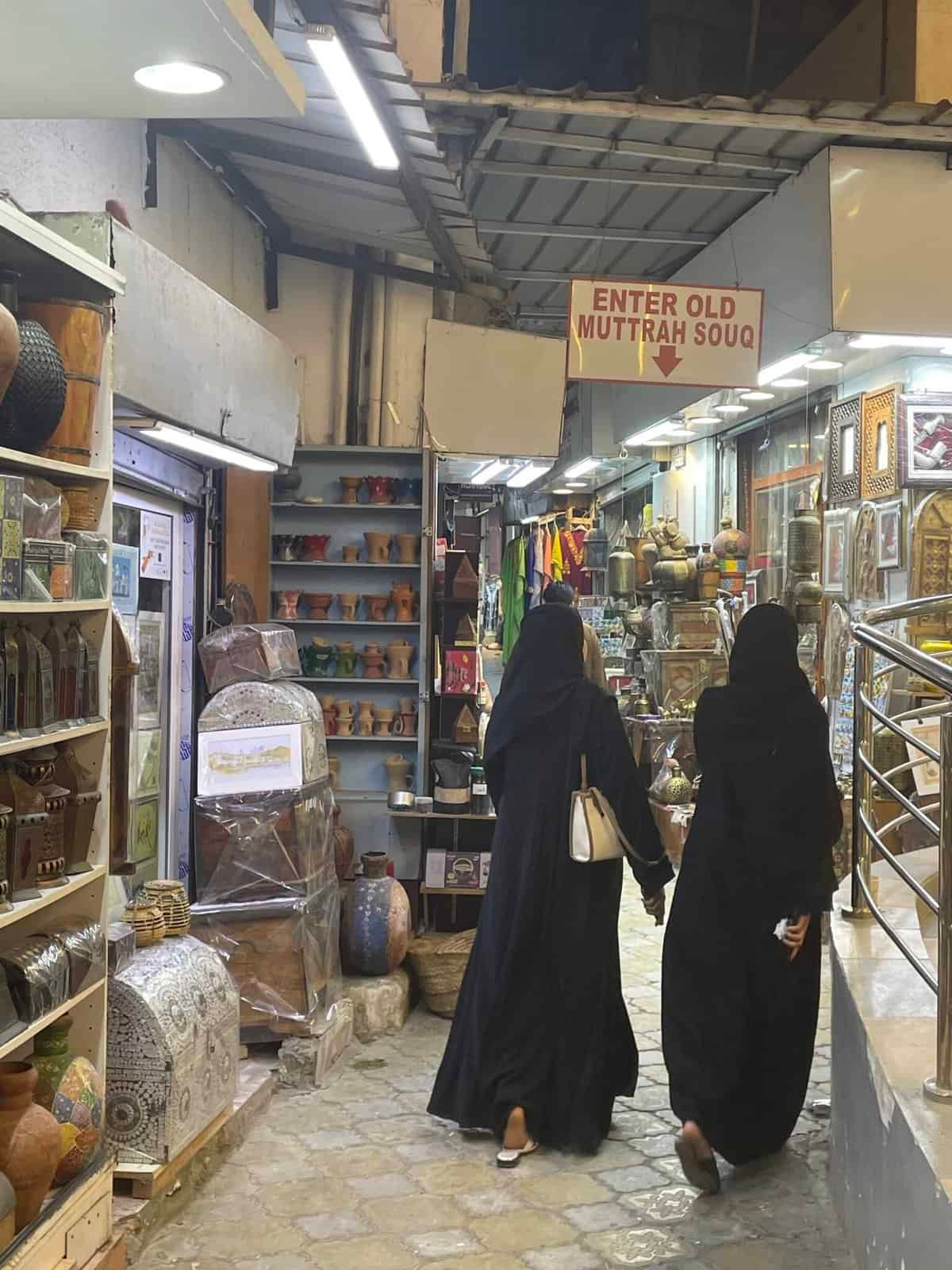 Two Omani women entering the Old Souq of Mutrah