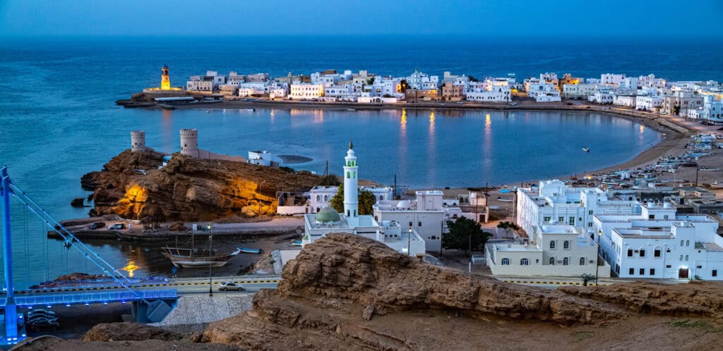The bay of Sur in Oman lit up at night