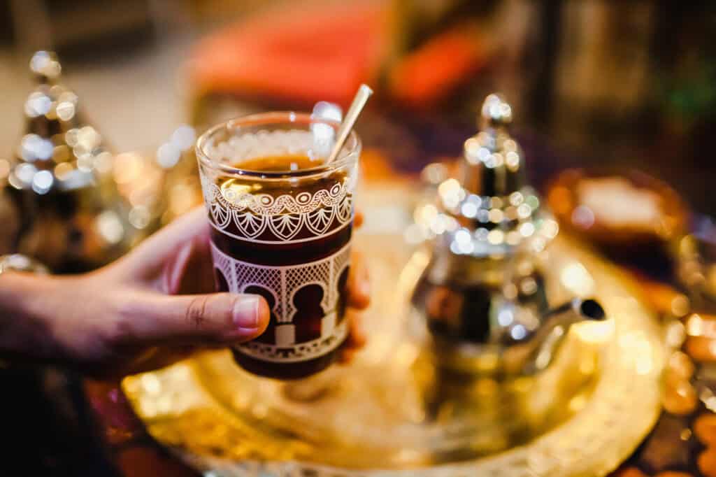 Arabic tea with teapot on a golden platter