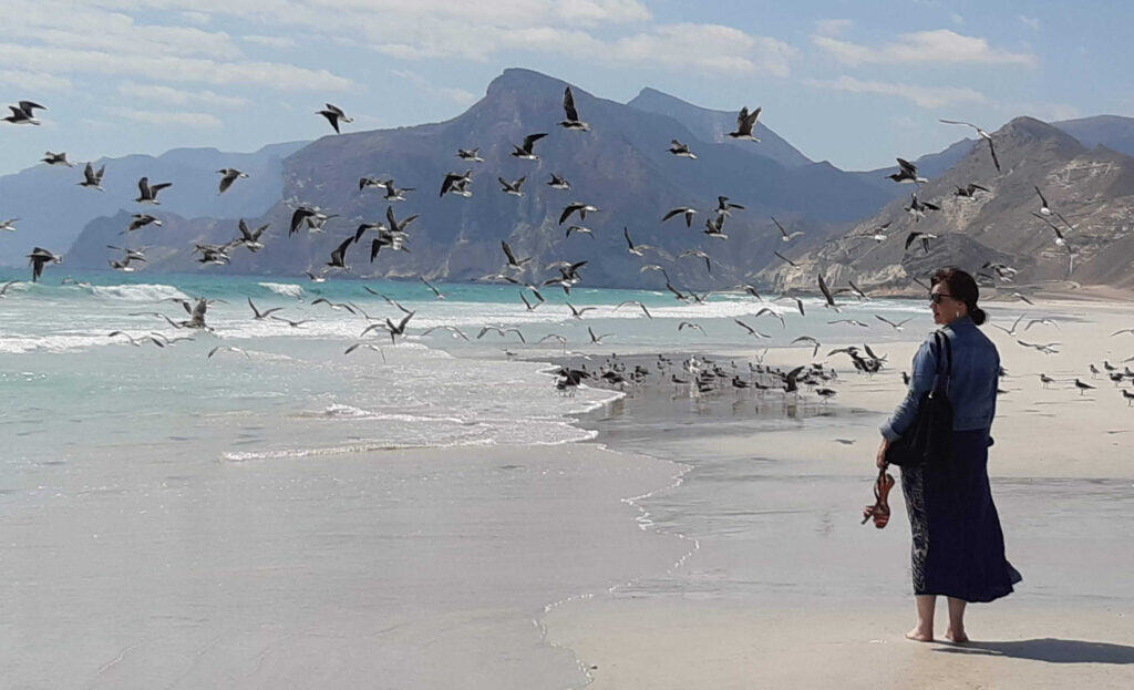 Christine walking on Mughsail beach