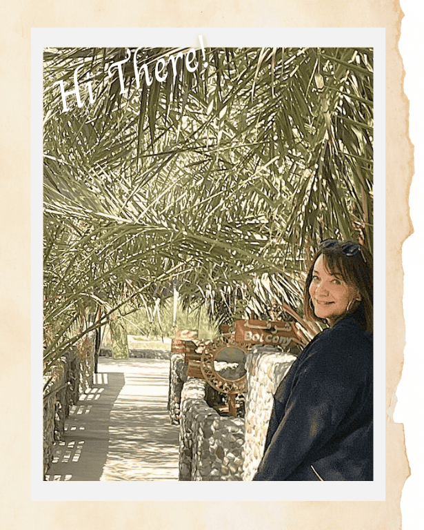 Christine, the creator of Joussour to Oman, standing near a small bridge in Fanja, Oman