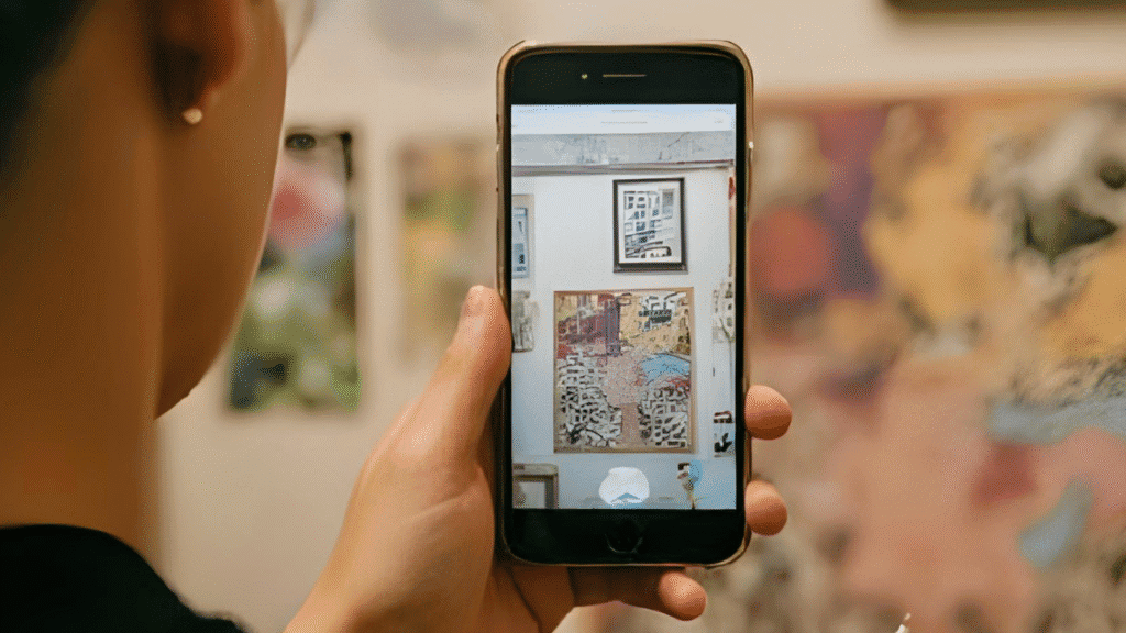 Someone looking at an account of a local artist on their phone.