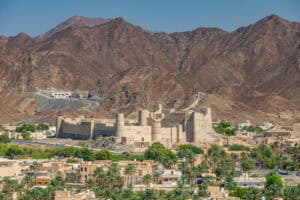 View of the town of Bahla with its imposing fort and the Hajar mountains in the background