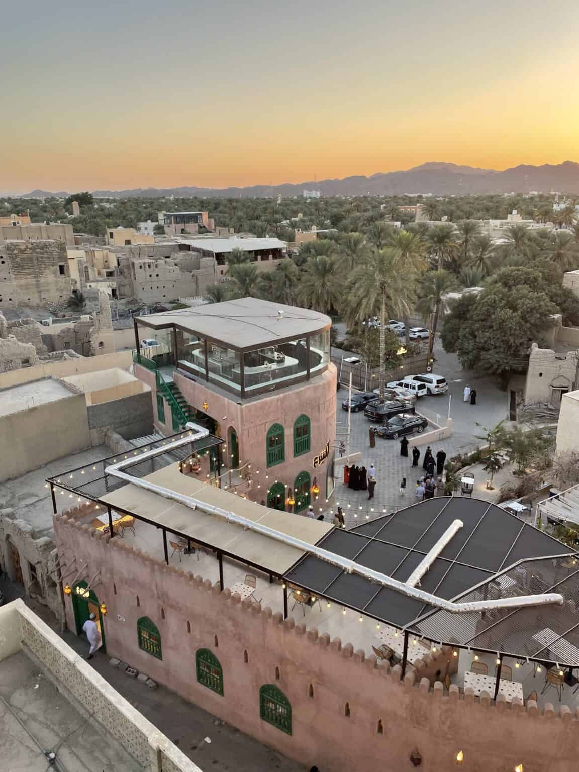 A view over the old part of Nizwa bathed in the golden light of the sunset.
