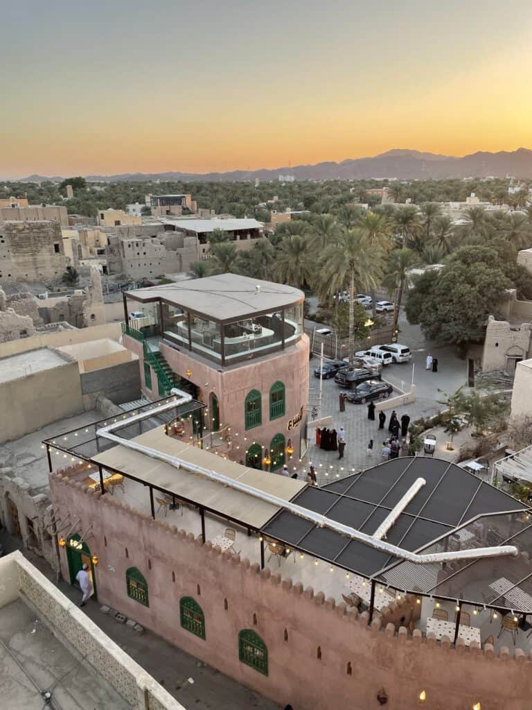 A view over the old part of Nizwa bathed in the golden light of the sunset.