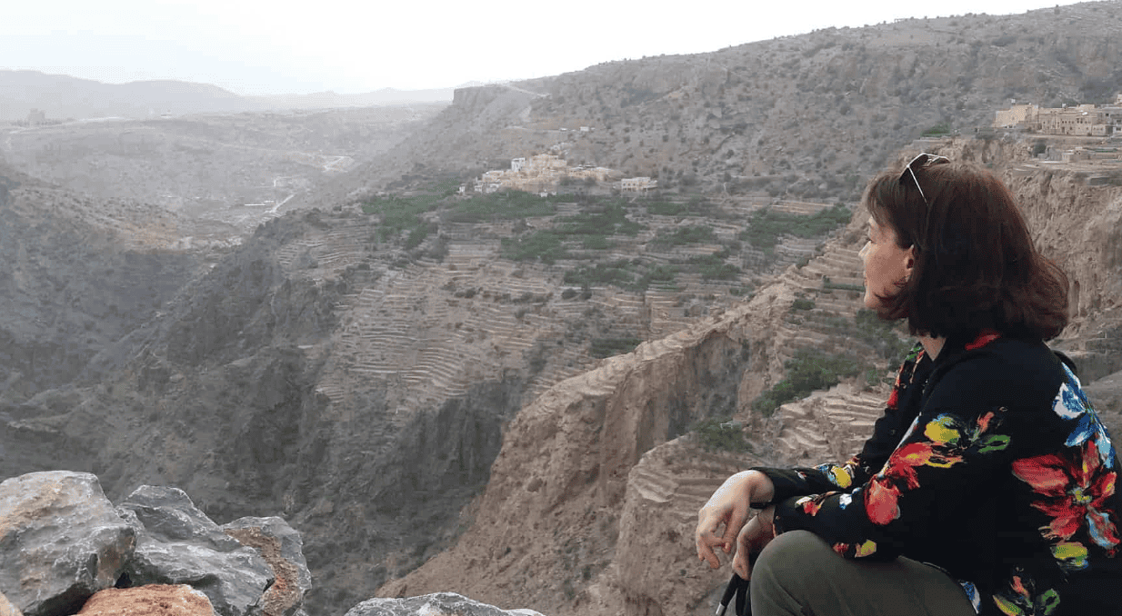 Photo of Christine, the creator of Joussour to Oman, overlooking Jebel Akhdar